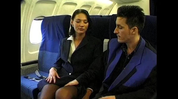 Brunette beauty wearing stewardess uniform gets fucked on a plane Ống mới