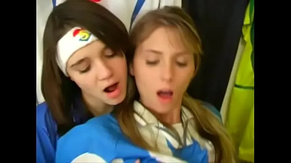 Ny Girls from argentina and italy football uniforms have a nice time at the locker room fresh tube
